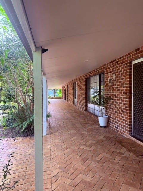 The front verandah of the Emerald Beach home looking onto the garden